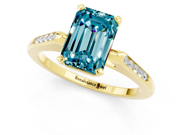 Yellow gold Emerald Cut Blue Topaz Solitaire Ring with Channel Set Round  Band and Prong Setting