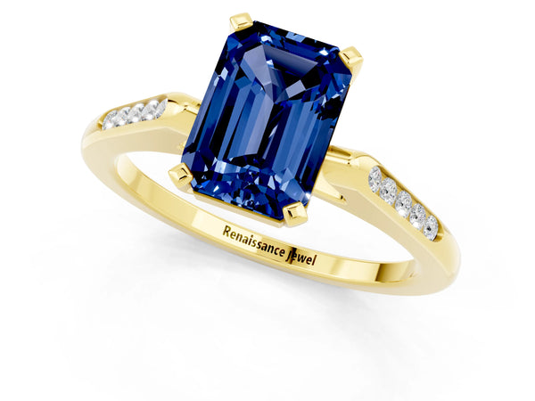 Yellow gold Emerald Cut Blue Sapphire Solitaire Ring with Channel Set Round  Band and Prong Setting