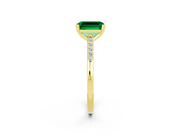 Yellow gold Emerald Cut Emerald Solitaire Ring with Channel Set Round  Band and Prong Setting