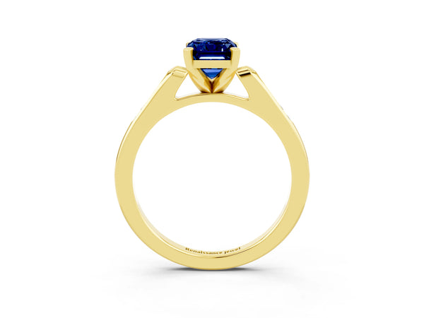 Yellow gold Emerald Cut Blue Sapphire Solitaire Ring with Channel Set Round  Band and Prong Setting