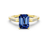 Yellow gold Emerald Cut Cut Channel Set Solitaire Engagement Ring with Four-Prong Setting