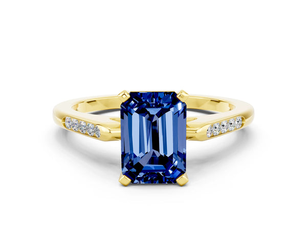 Yellow gold Emerald Cut Blue Sapphire Solitaire Ring with Channel Set Round  Band and Prong Setting