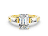 Yellow gold Emerald Cut Cut Diamond Ring with Tapered Baguette Side Stones in Four-Prong Setting