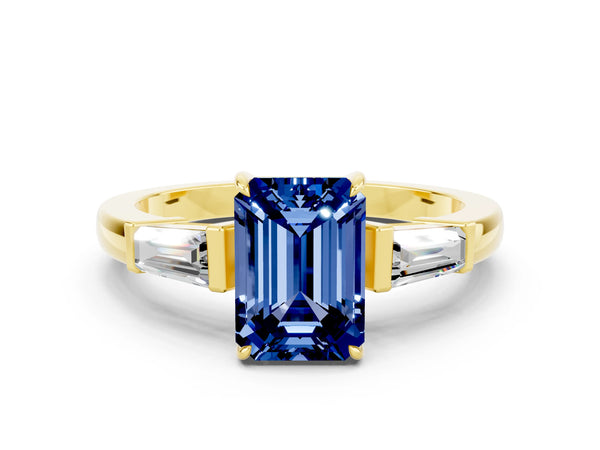 Yellow gold Emerald Cut Blue Sapphire Three-Stone Ring with Tapered Baguette Side Stones and Prong Setting