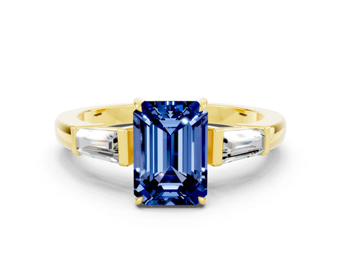 Yellow gold Emerald Cut Cut Diamond Ring with Tapered Baguette Side Stones in Four-Prong Setting