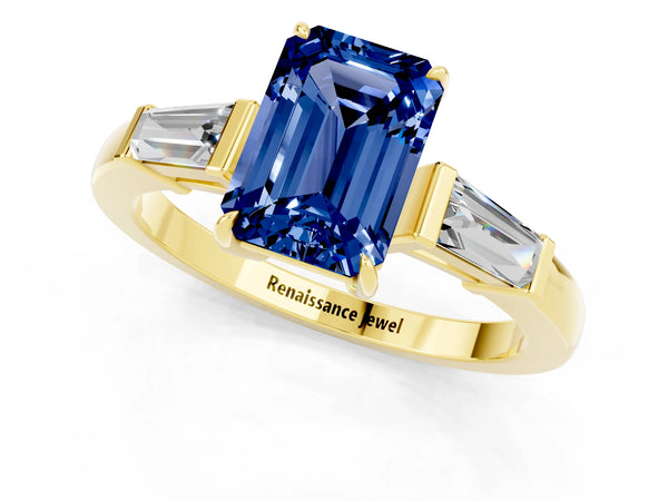 Yellow gold Emerald Cut Blue Sapphire Three-Stone Ring with Tapered Baguette Side Stones and Prong Setting