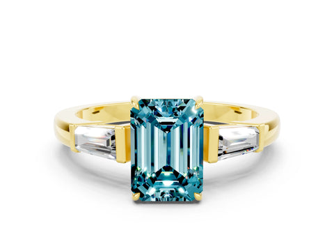 Yellow gold Emerald Cut Cut Diamond Ring with Tapered Baguette Side Stones in Four-Prong Setting
