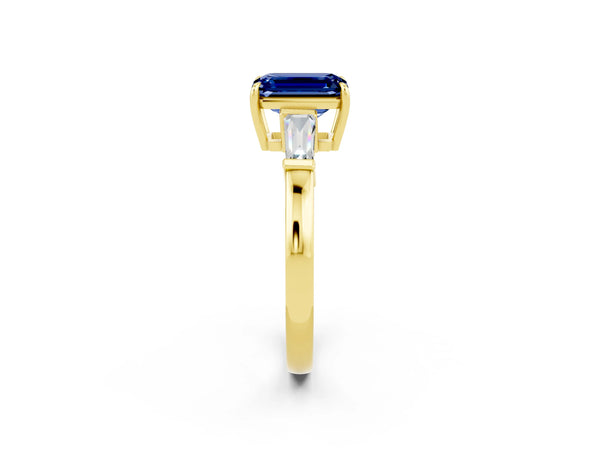 Yellow gold Emerald Cut Blue Sapphire Three-Stone Ring with Tapered Baguette Side Stones and Prong Setting