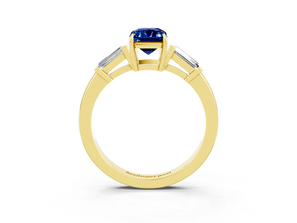 Yellow gold Emerald Cut Blue Sapphire Three-Stone Ring with Tapered Baguette Side Stones and Prong Setting