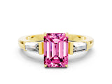 Yellow gold Emerald Cut Cut Diamond Ring with Tapered Baguette Side Stones in Four-Prong Setting