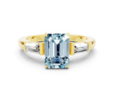 Yellow gold Emerald Cut Cut Diamond Ring with Tapered Baguette Side Stones in Four-Prong Setting