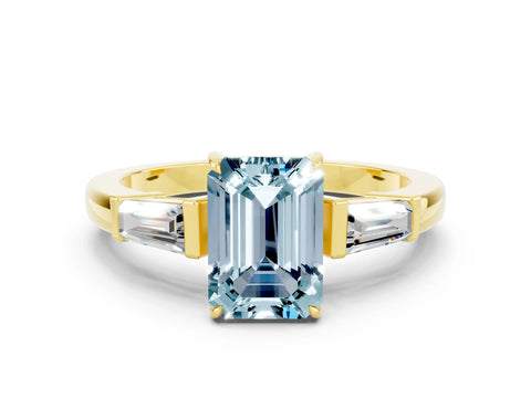 Yellow gold Emerald Cut Cut Diamond Ring with Tapered Baguette Side Stones in Four-Prong Setting