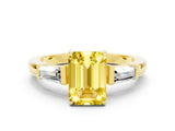 Yellow gold Emerald Cut Cut Diamond Ring with Tapered Baguette Side Stones in Four-Prong Setting
