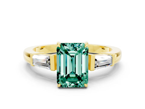 Yellow gold Emerald Cut Cut Diamond Ring with Tapered Baguette Side Stones in Four-Prong Setting