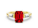 Yellow gold Emerald Cut Cut Diamond Ring with Tapered Baguette Side Stones in Four-Prong Setting