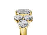 Yellow gold Emerald Cut Diamond Cluster Ring with Round Accent Stones and Prong Setting on a Classic Band_66