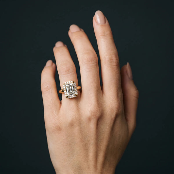 Yellow gold Emerald Cut Diamond Halo Engagement Ring with Split Shank and Four-Prong Setting