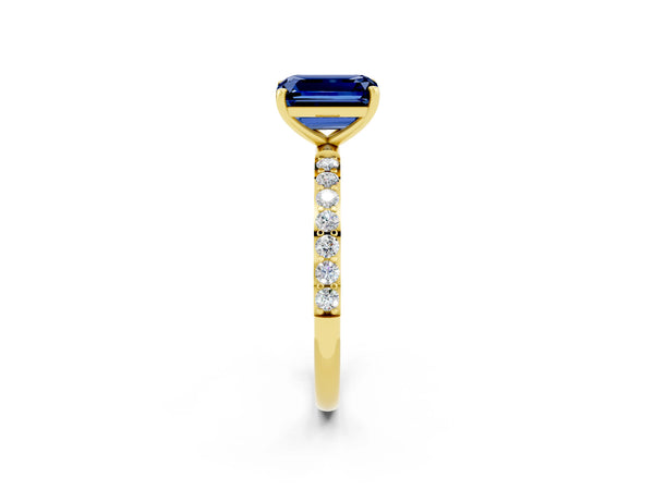 Yellow gold Emerald Cut Blue Sapphire Solitaire Ring with Round Pavé Shoulders and Prong Setting