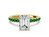 Yellow gold Emerald Cut Diamond Pave Band Solitaire Ring with Round with Emerald side stone and Prong Setting