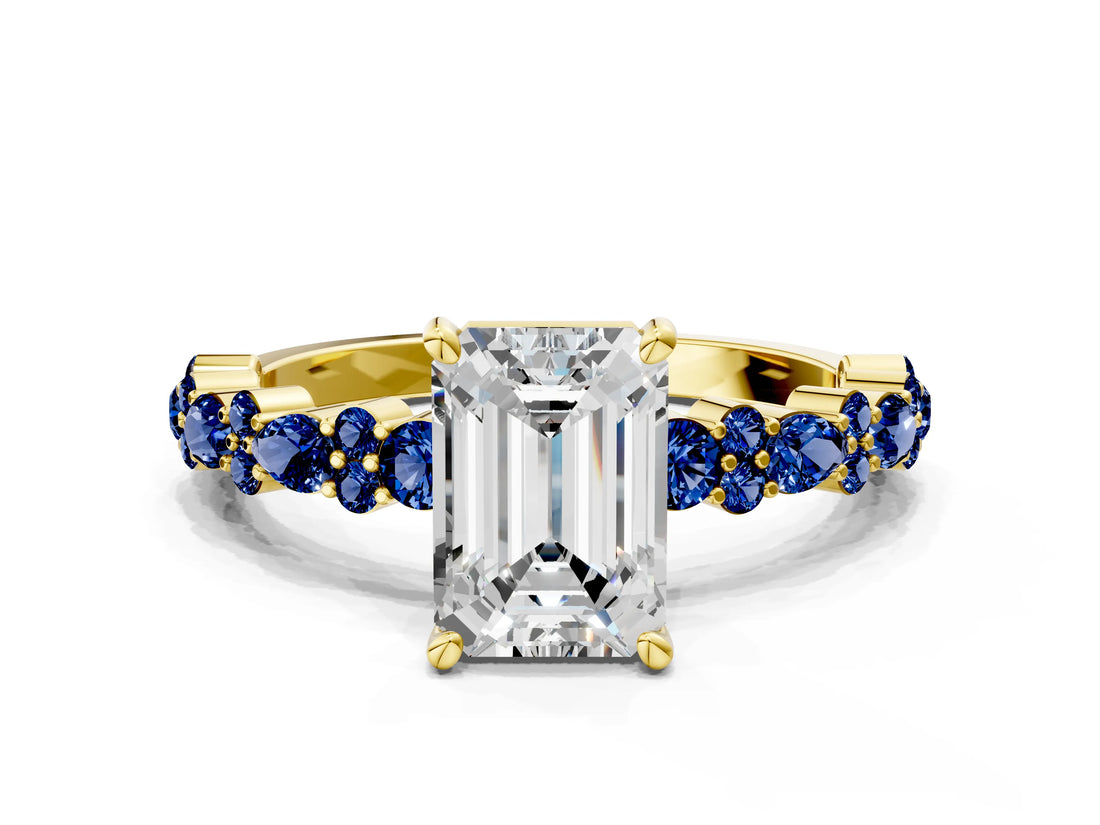 Yellow gold Emerald Cut Diamond Side Stone Solitaire Ring with Round with Blue Sapphire side stone and Four-Prong Setting