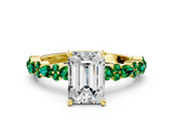 Yellow gold Emerald Cut Diamond Side Stone Solitaire Ring with Round with Emerald side stone and Four-Prong Setting