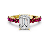 Yellow gold Emerald Cut Diamond Side Stone Solitaire Ring with Round with Garnet side stone and Four-Prong Setting