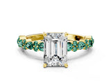 Yellow gold Emerald Cut Diamond Side Stone Solitaire Ring with Round with Green Sapphire side stone and Four-Prong Setting