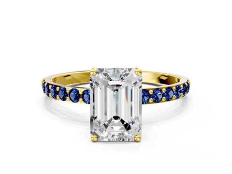 Yellow gold Emerald Cut Diamond Solitaire Engagement Ring with Round with Blue Sapphire side stone Pavé Band and Prong Setting