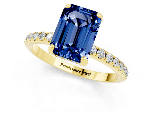 Yellow gold Emerald Cut Blue Sapphire Hidden Halo Engagement Ring with Round Pavé Band and Prong Setting