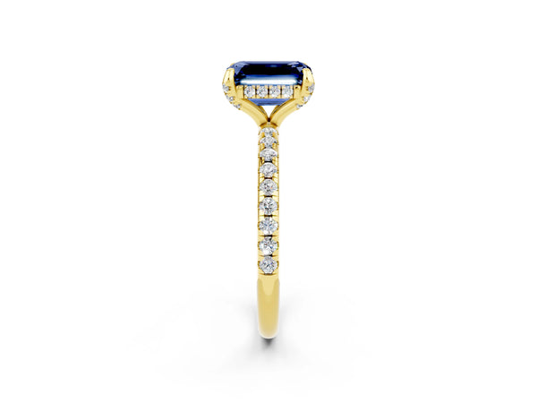 Yellow gold Emerald Cut Blue Sapphire Hidden Halo Engagement Ring with Round Pavé Band and Prong Setting
