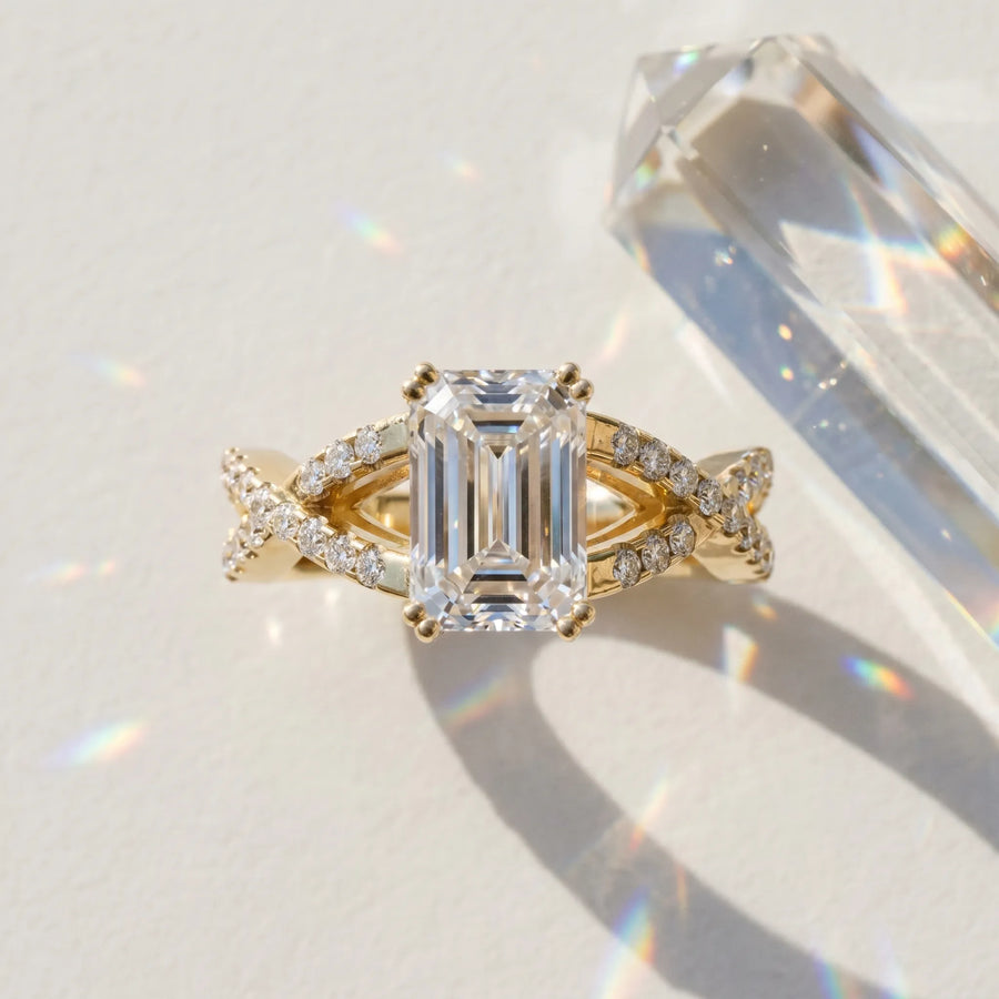 Yellow gold Emerald Cut Diamond Solitaire Ring with Four-Prong Setting and Twisted Pavé Band
