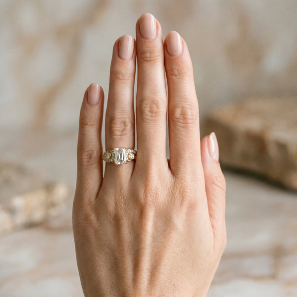 Yellow gold Emerald Cut Diamond Solitaire Ring with Milgrain Pavé Band and Four-Prong Setting