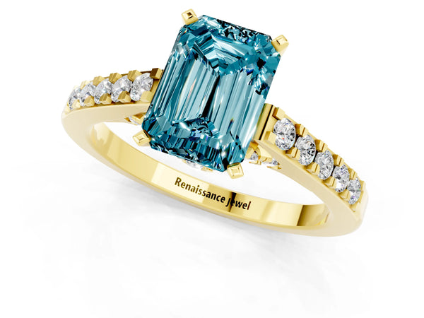 Yellow gold Emerald Cut Blue Topaz Solitaire Ring with Crossover Gallery and Round  Pavé Band