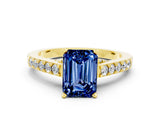 Yellow gold Emerald Cut Diamond Solitaire Ring with Pavé Band and Prong Setting
