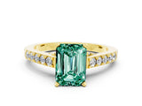 Yellow gold Emerald Cut Diamond Solitaire Ring with Pavé Band and Prong Setting