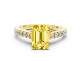Yellow gold Emerald Cut Diamond Solitaire Ring with Pavé Band and Prong Setting