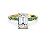 Yellow gold Emerald Cut Diamond Solitaire Ring with Round with Green Sapphire side stone Pavé Band and Prong Setting