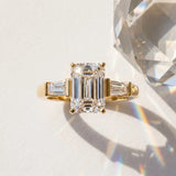 Yellow gold Emerald Cut Diamond Solitaire Ring with Tapered Baguette Accents and Four-Prong Setting_15