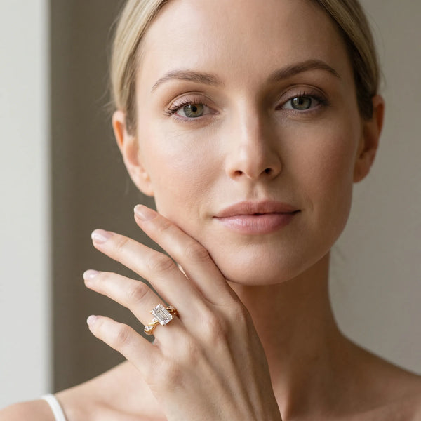 Yellow gold Emerald Cut Diamond Solitaire Ring with Twisted Band and Pavé Accents