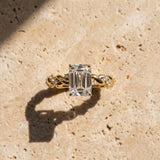 Yellow gold Emerald Cut Diamond Solitaire Ring with Twisted Band and Pavé Accents_37