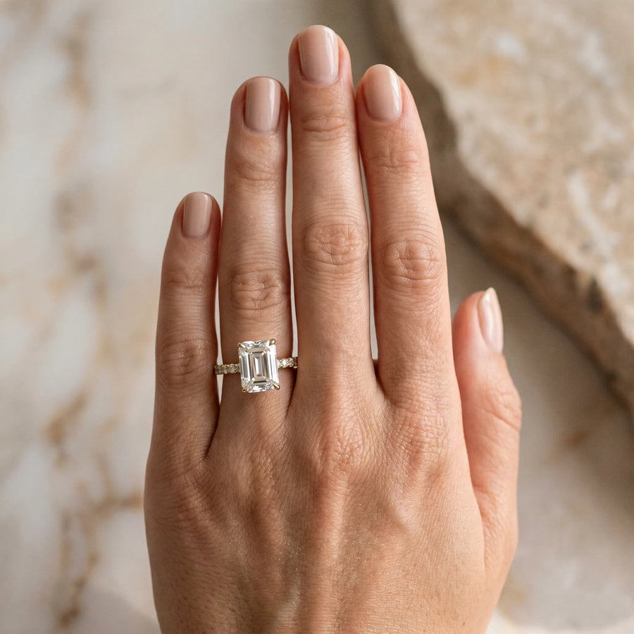 Yellow gold Emerald Cut Diamond Solitaire Ring with U-Prong Diamond Band and Four Prong Setting