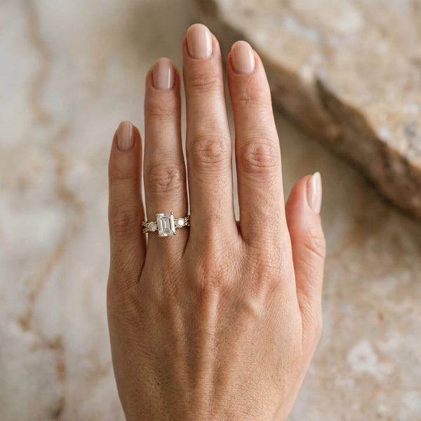 Yellow gold Emerald Cut Diamond Three-Stone Ring with Pavé Split Shank and Four-Prong Setting