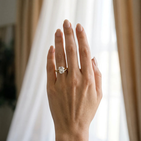Yellow gold Emerald Cut Diamond Twisted Band Engagement Ring with Prong Setting