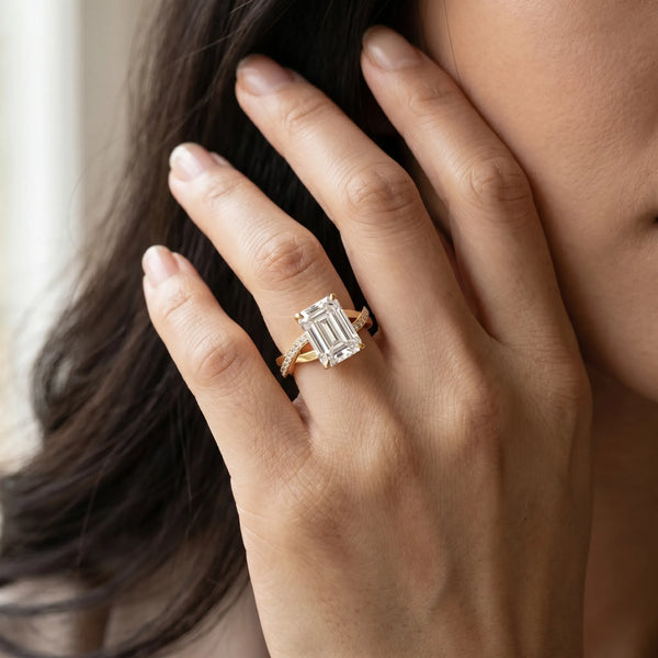 Yellow gold Emerald Cut Diamond Twisted Band Engagement Ring with Prong Setting