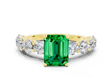 Yellow gold Emerald Cut Emerald Prong Setting with Side Stones on a Pave Band
