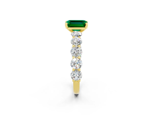 Yellow gold Emerald Cut Emerald Prong Setting with Side Stones on a Pave Band