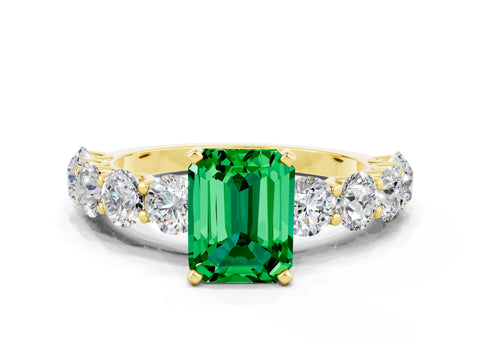 Yellow gold Emerald Cut Emerald Prong Setting with Side Stones on a Pave Band