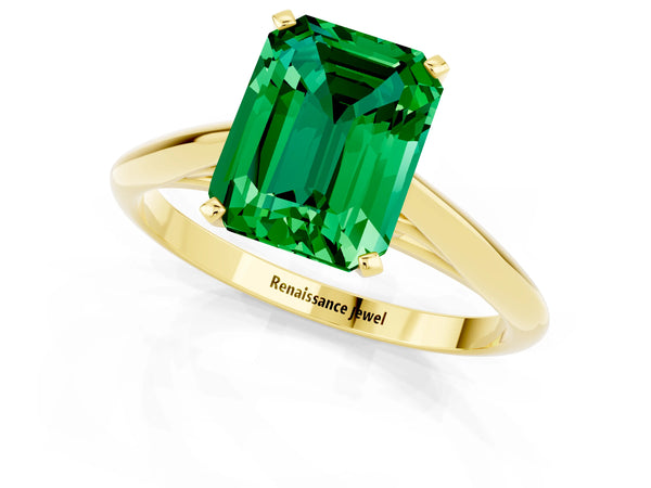 Yellow gold Emerald Cut Emerald Solitaire Engagement Ring with Cathedral Setting and Four-Prong Mount