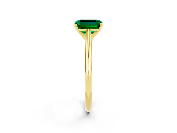 Yellow gold Emerald Cut Emerald Solitaire Engagement Ring with Cathedral Setting and Four-Prong Mount