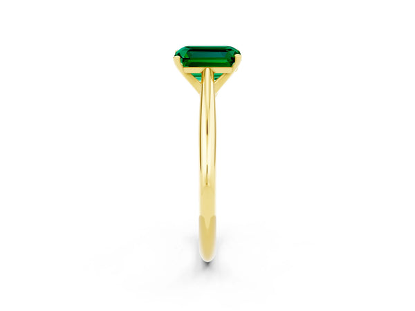 Yellow gold Emerald Cut Emerald Solitaire Engagement Ring with Cathedral Setting and Four-Prong Mount